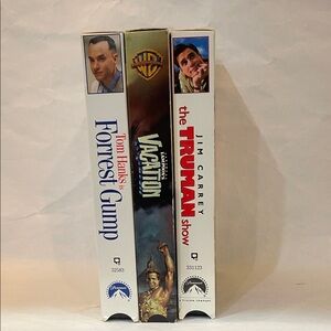 3 VHS movies. Forrest Gump, the Truman Show, and National Lampoon’s Vacation